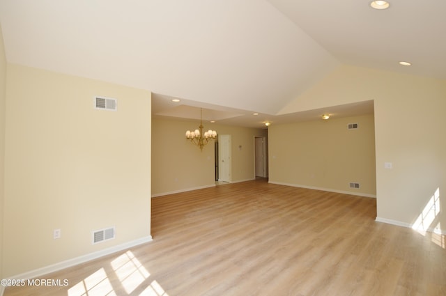 3168 Wood Spring Ln, Toms River, NJ 08755 - empty room with a chandelier, vaulted ceiling, recessed lighting, and light wood finished floors