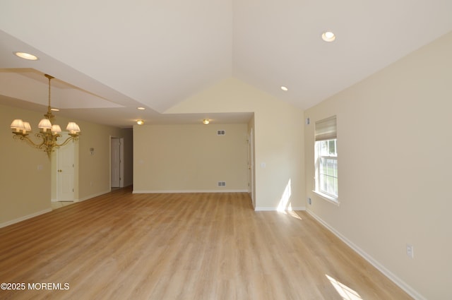 3168 Wood Spring Ln, Toms River, NJ 08755 - unfurnished room with a chandelier, vaulted ceiling, recessed lighting, and light wood-style flooring