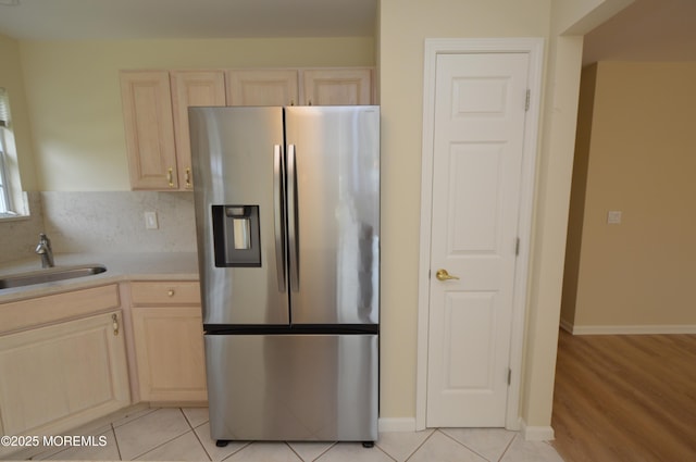 3168 Wood Spring Ln, Toms River, NJ 08755 - kitchen with stainless steel refrigerator with ice dispenser, light brown cabinetry, light countertops, and light tile patterned floors