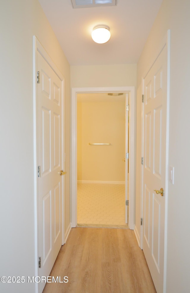 3168 Wood Spring Ln, Toms River, NJ 08755 - hall featuring light wood-style flooring and baseboards