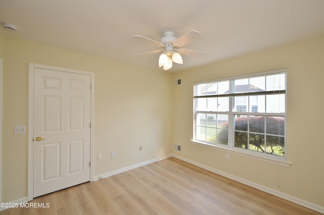 3168 Wood Spring Ln, Toms River, NJ 08755 - spare room featuring a smoke detector, light wood-style floors, and a ceiling fan