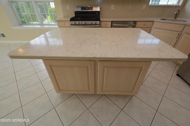 3168 Wood Spring Ln, Toms River, NJ 08755 - kitchen featuring stainless steel appliances, light brown cabinetry, and healthy amount of natural light