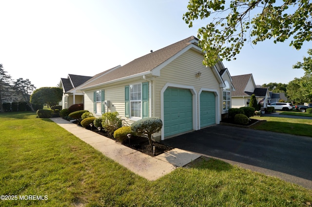 3168 Wood Spring Ln, Toms River, NJ 08755 - view of property exterior with a lawn, asphalt driveway, a garage, and roof with shingles
