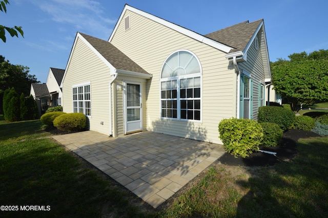 3168 Wood Spring Ln, Toms River, NJ 08755 - back of house with a patio area, a shingled roof, and a yard