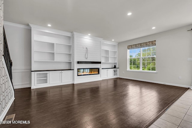 44 Begonia Ln, Monroe, NJ 08831 - unfurnished living room with a fireplace, wood finished floors, recessed lighting, built in features, and crown molding