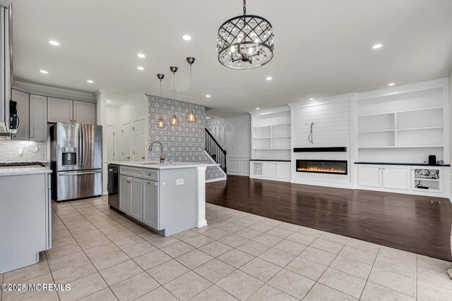 44 Begonia Ln, Monroe, NJ 08831 - kitchen with stainless steel fridge, gray cabinetry, dishwashing machine, light tile patterned floors, and light countertops