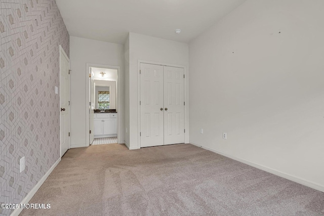 44 Begonia Ln, Monroe, NJ 08831 - unfurnished bedroom with light colored carpet, wallpapered walls, ensuite bath, and a closet