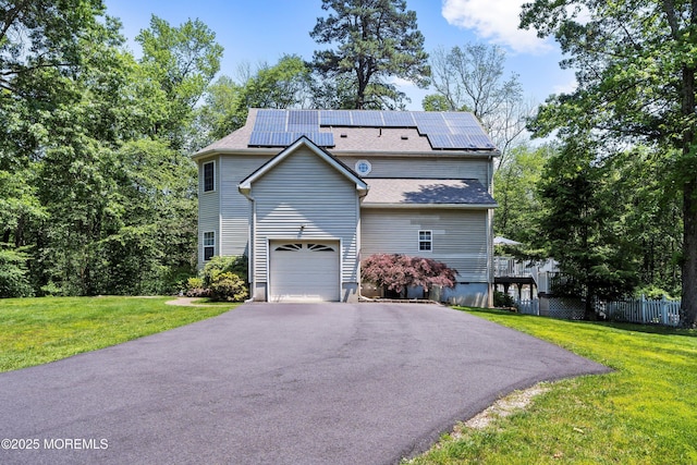 301 Cranberry Rd, Farmingdale, NJ 07727 - view of front of property featuring solar panels, asphalt driveway, and a garage
