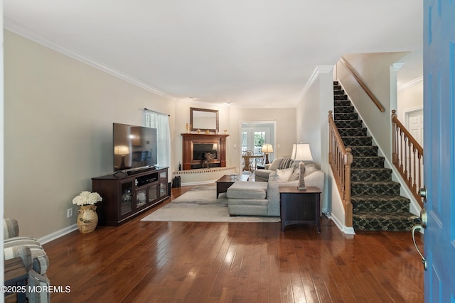 301 Cranberry Rd, Farmingdale, NJ 07727 - living room with stairway, dark wood finished floors, ornamental molding, and a fireplace with raised hearth