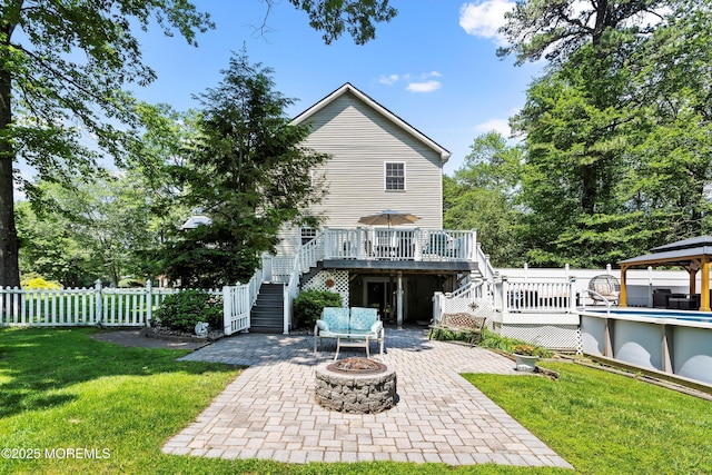 301 Cranberry Rd, Farmingdale, NJ 07727 - rear view of property with stairs, a wooden deck, an outdoor fire pit, a gazebo, and a patio