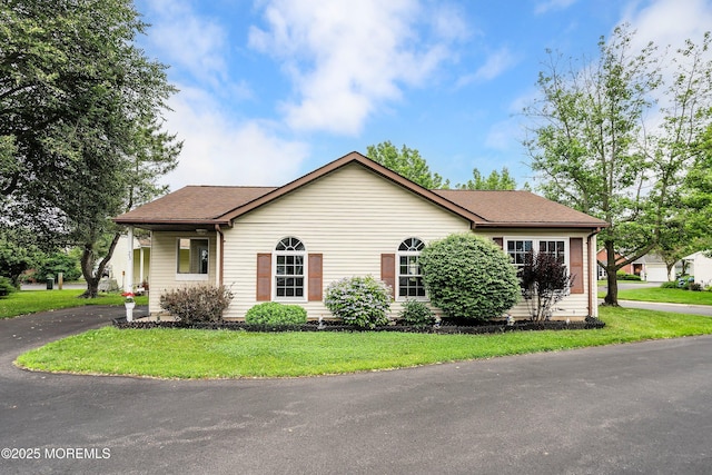 23 Datchet Close Unit 1000, Freehold, NJ 07728 - view of front of property featuring a shingled roof and a front yard