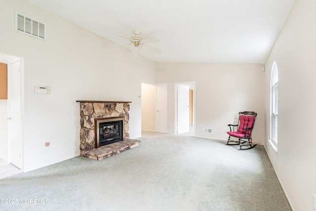 23 Datchet Close Unit 1000, Freehold, NJ 07728 - unfurnished living room featuring lofted ceiling, carpet floors, plenty of natural light, ceiling fan, and a stone fireplace