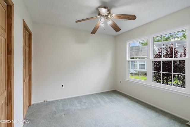 23 Datchet Close Unit 1000, Freehold, NJ 07728 - empty room featuring light carpet, a textured ceiling, and a ceiling fan