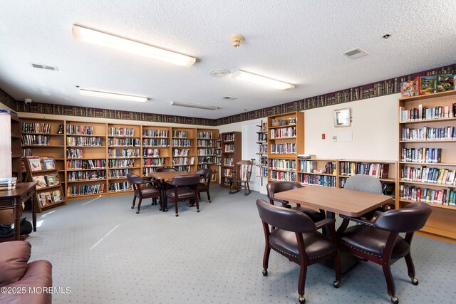 23 Datchet Close Unit 1000, Freehold, NJ 07728 - carpeted office featuring bookshelves and a textured ceiling