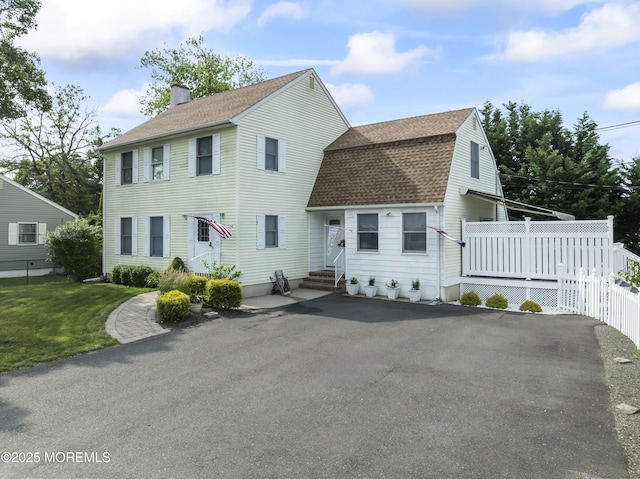 387 Barnegat Ln, Brick, NJ 08723 - view of front of home with entry steps, a shingled roof, a chimney, and a gambrel roof