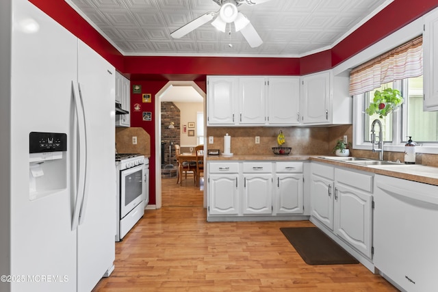 387 Barnegat Ln, Brick, NJ 08723 - kitchen with white appliances, ceiling fan, an ornate ceiling, white cabinets, and backsplash