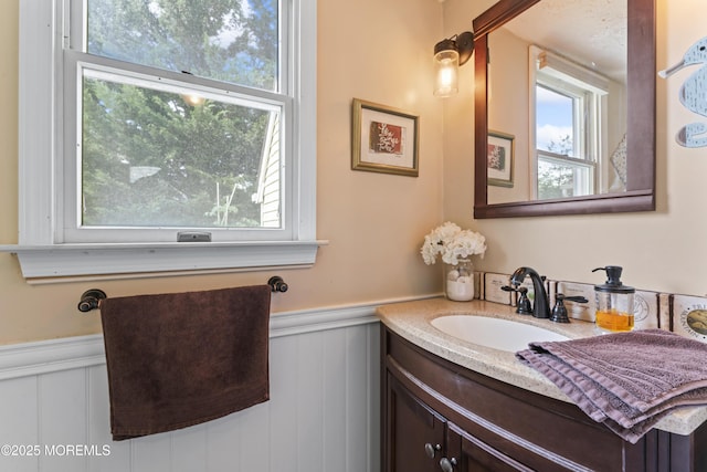 387 Barnegat Ln, Brick, NJ 08723 - bathroom featuring vanity, a wainscoted wall, plenty of natural light, and a decorative wall