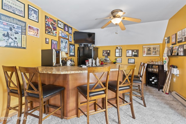 387 Barnegat Ln, Brick, NJ 08723 - indoor dry bar featuring freestanding refrigerator, light colored carpet, ceiling fan, baseboard heating, and vaulted ceiling