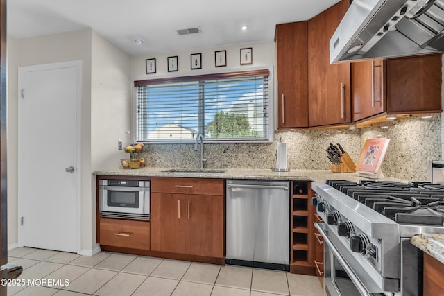 45 Victory Ct, Old Bridge, NJ 08857 - kitchen featuring ventilation hood, appliances with stainless steel finishes, brown cabinetry, decorative backsplash, and recessed lighting