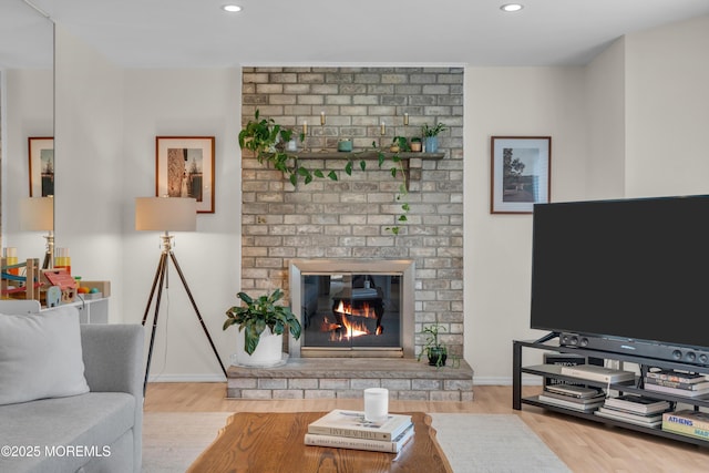 45 Victory Ct, Old Bridge, NJ 08857 - living area featuring wood finished floors, recessed lighting, and a brick fireplace