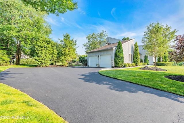 3058 Governors Xing, Wall, NJ 07719 - view of property exterior featuring driveway, a garage, board and batten siding, and a lawn