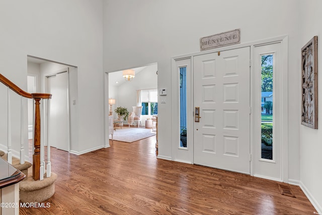3058 Governors Xing, Wall, NJ 07719 - entrance foyer with stairs, wood finished floors, and a towering ceiling