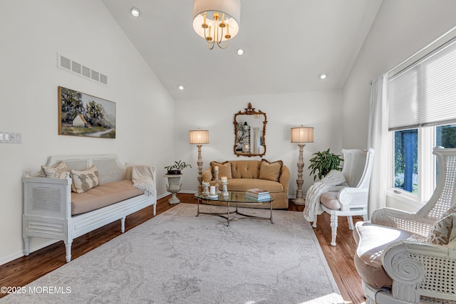 3058 Governors Xing, Wall, NJ 07719 - living area featuring high vaulted ceiling, wood finished floors, a chandelier, and recessed lighting