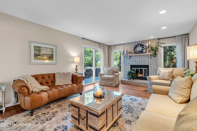 3058 Governors Xing, Wall, NJ 07719 - living area featuring wood finished floors, a brick fireplace, and recessed lighting