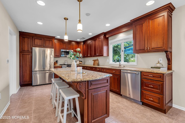 3058 Governors Xing, Wall, NJ 07719 - kitchen with appliances with stainless steel finishes, a center island, light stone counters, hanging light fixtures, and a breakfast bar area