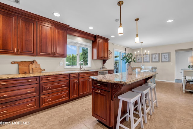 3058 Governors Xing, Wall, NJ 07719 - kitchen featuring a breakfast bar area, dishwasher, decorative light fixtures, a chandelier, and light stone countertops