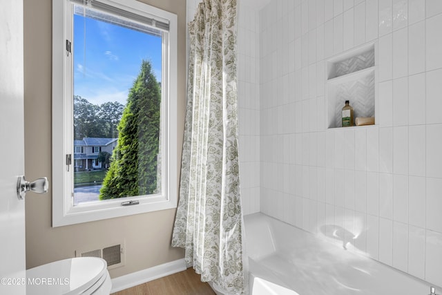 3058 Governors Xing, Wall, NJ 07719 - bathroom featuring shower / bath combo and wood finished floors