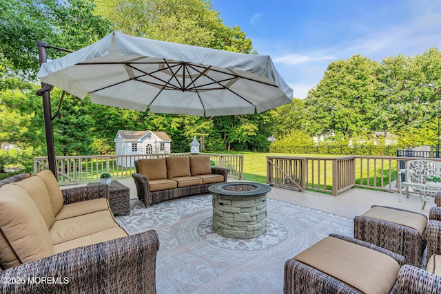 3058 Governors Xing, Wall, NJ 07719 - deck with an outdoor living space with a fire pit, an outdoor structure, and view of wooded area
