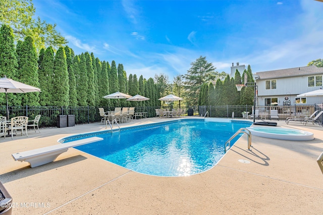 3058 Governors Xing, Wall, NJ 07719 - view of swimming pool with outdoor dining space, a diving board, a patio area, and an in-ground hot tub