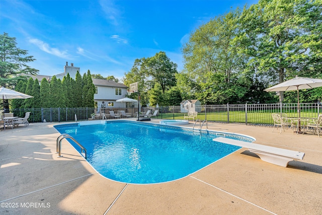 3058 Governors Xing, Wall, NJ 07719 - view of pool featuring a patio, a diving board, outdoor dining area, and a storage shed