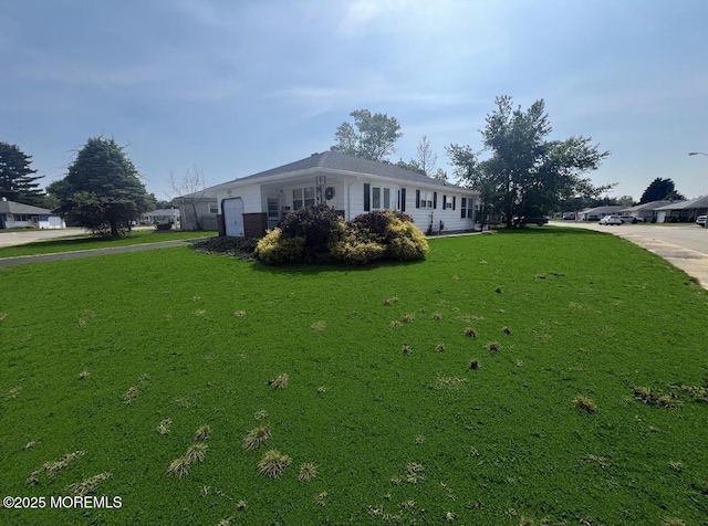 31 Guadeloupe Dr, Toms River, NJ 08757 - view of property exterior with driveway and a yard