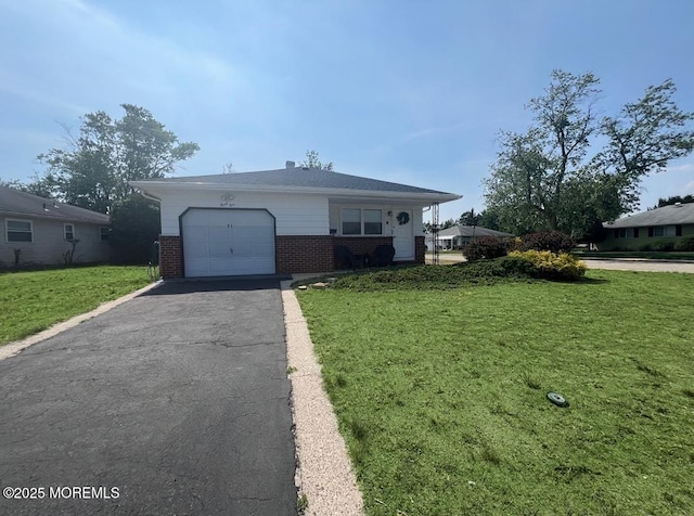 31 Guadeloupe Dr, Toms River, NJ 08757 - view of front of property with brick siding, an attached garage, a front yard, and driveway