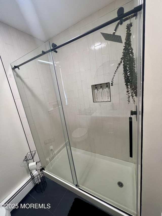 31 Guadeloupe Dr, Toms River, NJ 08757 - bathroom with a baseboard radiator, a shower stall, and tile patterned floors