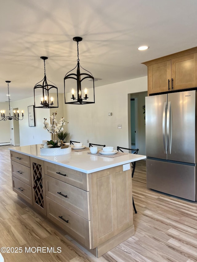 31 Guadeloupe Dr, Toms River, NJ 08757 - kitchen featuring freestanding refrigerator, a chandelier, light wood-style floors, light countertops, and a center island
