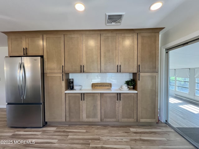 31 Guadeloupe Dr, Toms River, NJ 08757 - kitchen with freestanding refrigerator, backsplash, light wood-style floors, recessed lighting, and light countertops