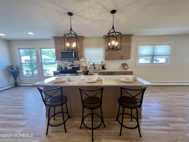 31 Guadeloupe Dr, Toms River, NJ 08757 - kitchen with appliances with stainless steel finishes, a baseboard heating unit, light wood-type flooring, light countertops, and recessed lighting