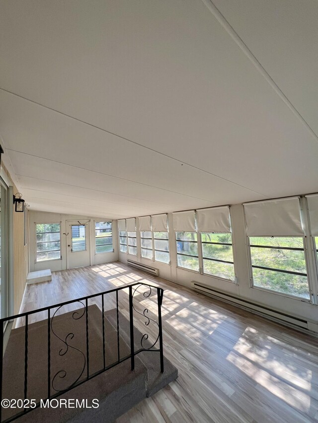31 Guadeloupe Dr, Toms River, NJ 08757 - unfurnished sunroom featuring wood finished floors and lofted ceiling