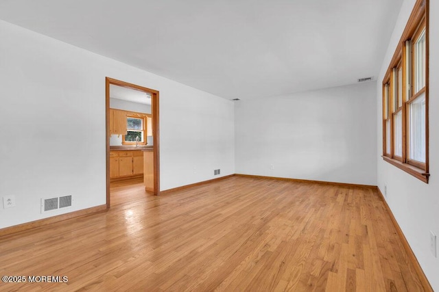 1131 Canal Dr, Point Pleasant, NJ 08742 - empty room featuring light wood-type flooring and a sink