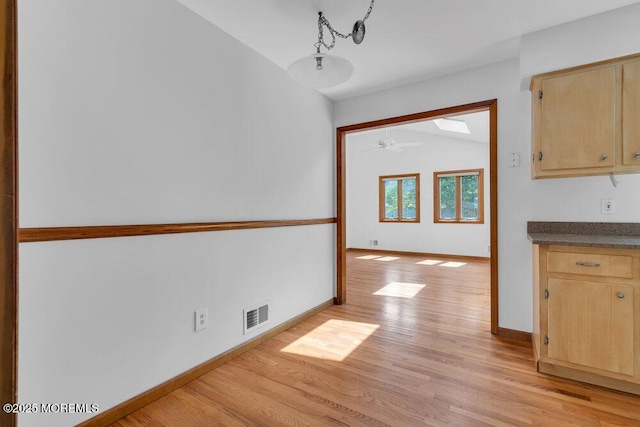 1131 Canal Dr, Point Pleasant, NJ 08742 - unfurnished dining area with light wood-style floors, vaulted ceiling, and ceiling fan