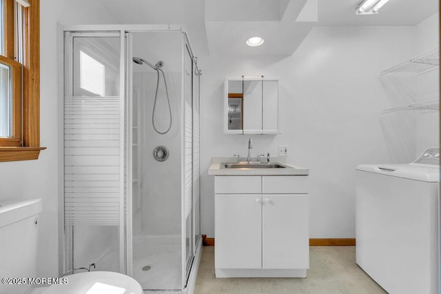 1131 Canal Dr, Point Pleasant, NJ 08742 - bathroom featuring washer / clothes dryer, a shower stall, vanity, and recessed lighting