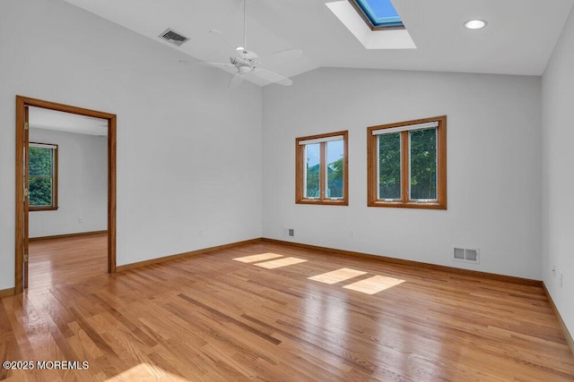 1131 Canal Dr, Point Pleasant, NJ 08742 - unfurnished room featuring a skylight, light wood-style flooring, a ceiling fan, and high vaulted ceiling
