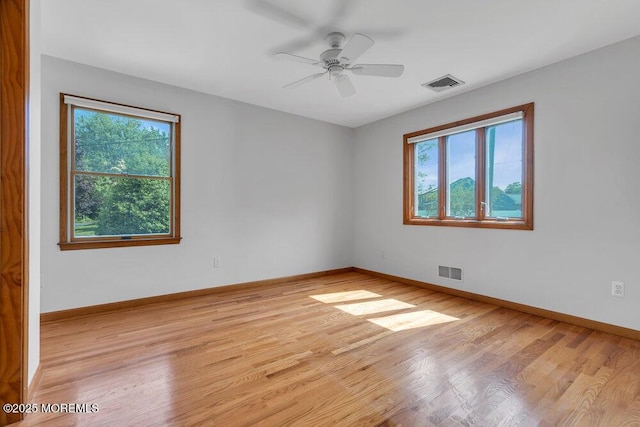 1131 Canal Dr, Point Pleasant, NJ 08742 - unfurnished room featuring plenty of natural light, light wood-style flooring, and a ceiling fan
