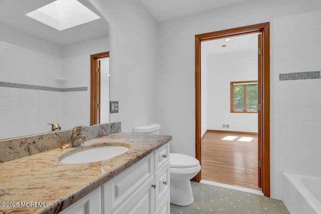 1131 Canal Dr, Point Pleasant, NJ 08742 - full bath featuring vanity, tile patterned floors, and a skylight