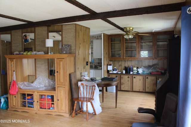 146 Mockingbird Way, Whiting, NJ 08759 - kitchen featuring ceiling fan, wood finished floors, beam ceiling, wood walls, and glass insert cabinets