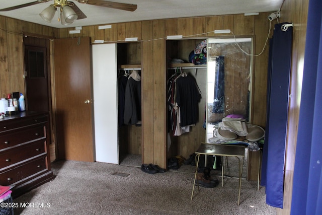 146 Mockingbird Way, Whiting, NJ 08759 - bedroom featuring carpet, wooden walls, two closets, and a ceiling fan