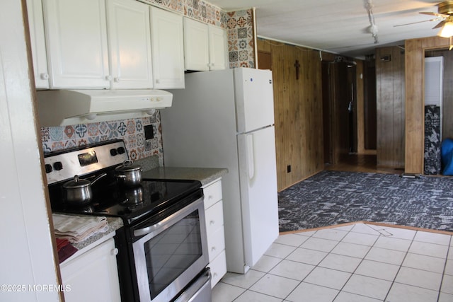 146 Mockingbird Way, Whiting, NJ 08759 - kitchen with stainless steel electric range, premium range hood, white cabinets, backsplash, and light tile patterned floors